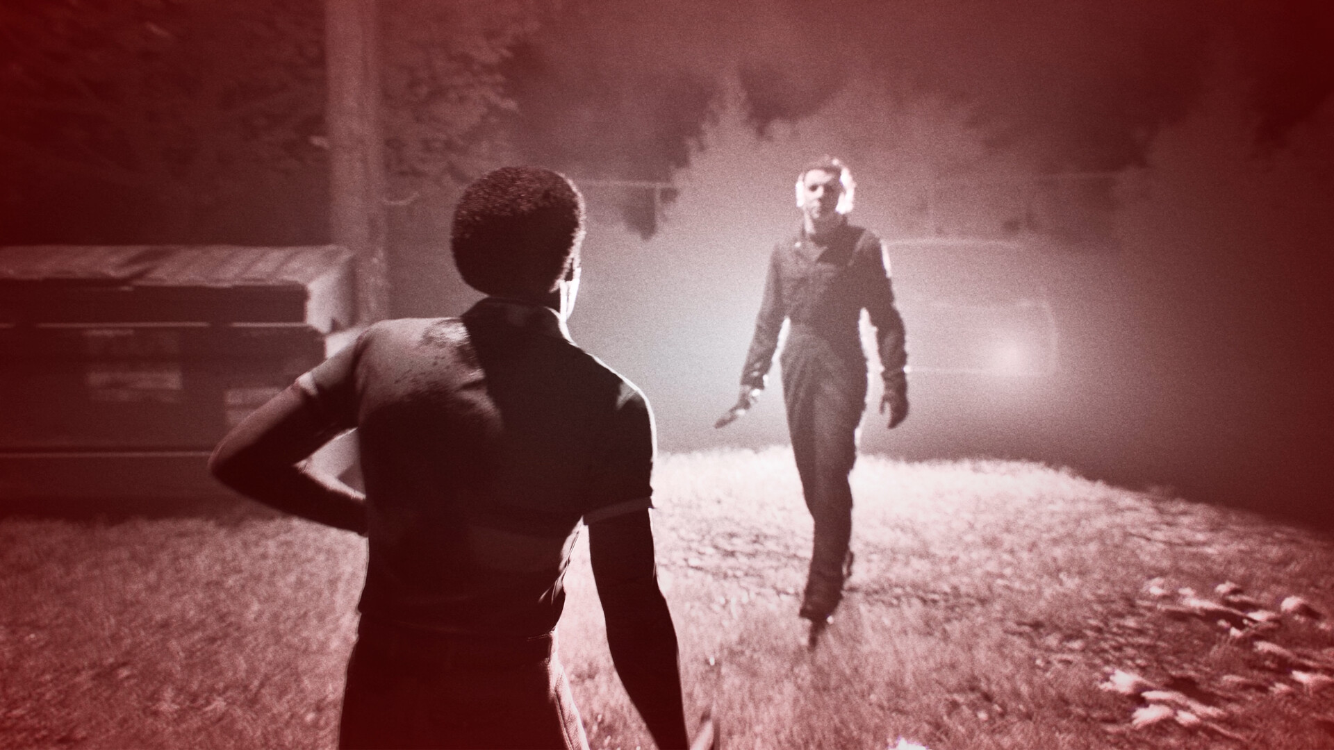 Halloween: The Game screenshot: Michael Myers closing in on a survivor at night